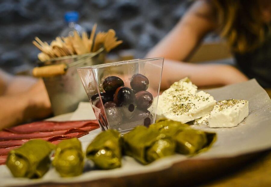 Athens: Ultimate Food Walking Tour with 15 Tastings - Olives, local products, and the final sweet course