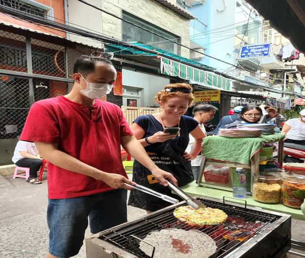 Authentic Walking Street Food Tour in Ho Chi Minh City - Grilled beef, betel leaves, and Vietnamese pizza