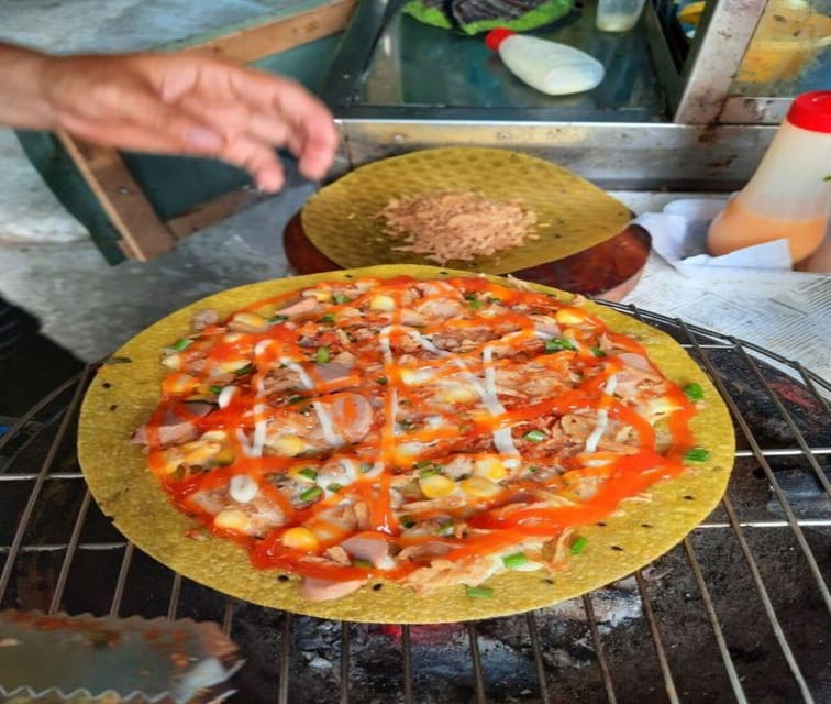 Authentic Walking Street Food Tour in Ho Chi Minh City - Bún bò Huế brings heat and a slower-cooked broth