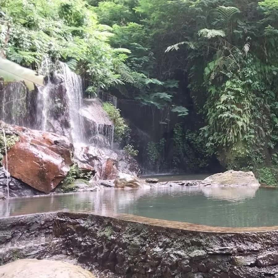 Bali: Penglipuran Village, Waterfall, and Night Market Tour - Goa Raja Waterfall and the shallow swimming pool