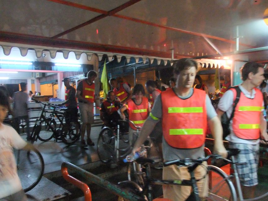 Bangkok by Night Cycling Tour with Street-food Meal - Riverside views of the Grand Palace and Memorial Bridge