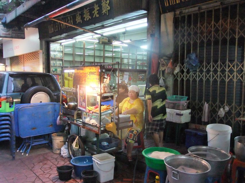 Bangkok by Night Cycling Tour with Street-food Meal - Crossing the Chao Phraya by pedestrian ferry