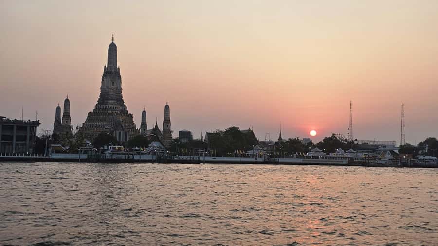 Bangkok: Wat Pho and Wat Arun Guided Walking Tour (2 Hours) - Wat Arun’s central prang and porcelain mosaics