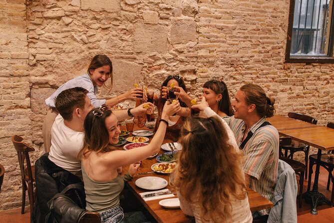 Barcelona: Guided Food Walking Tour with Tapas and Wine - Croquettes and patatas bravas on Carrer Ample
