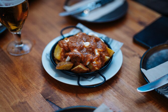 Barcelona Tapas Food Walking Tour with Wine in El Born - First bites on Carrer Ample