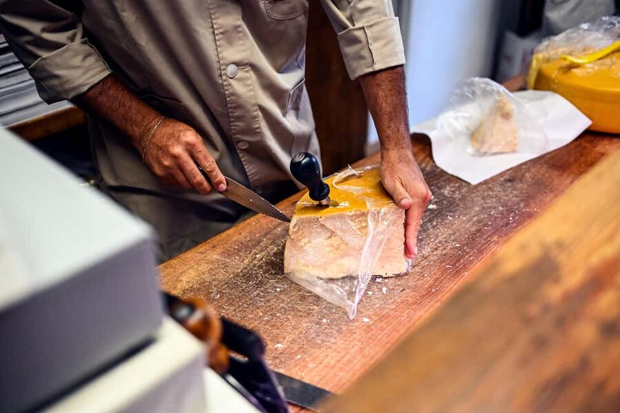 Bologna: Local Food Tour with Authentic Tastings and Wine - Prosciutto, Mortadella, and the King of Cheeses