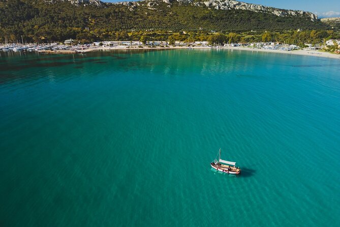 Cagliari : Gozzo Tour with 3 Swim Stops, Snorkeling & Local Food - Calamosca: the main swimming mood