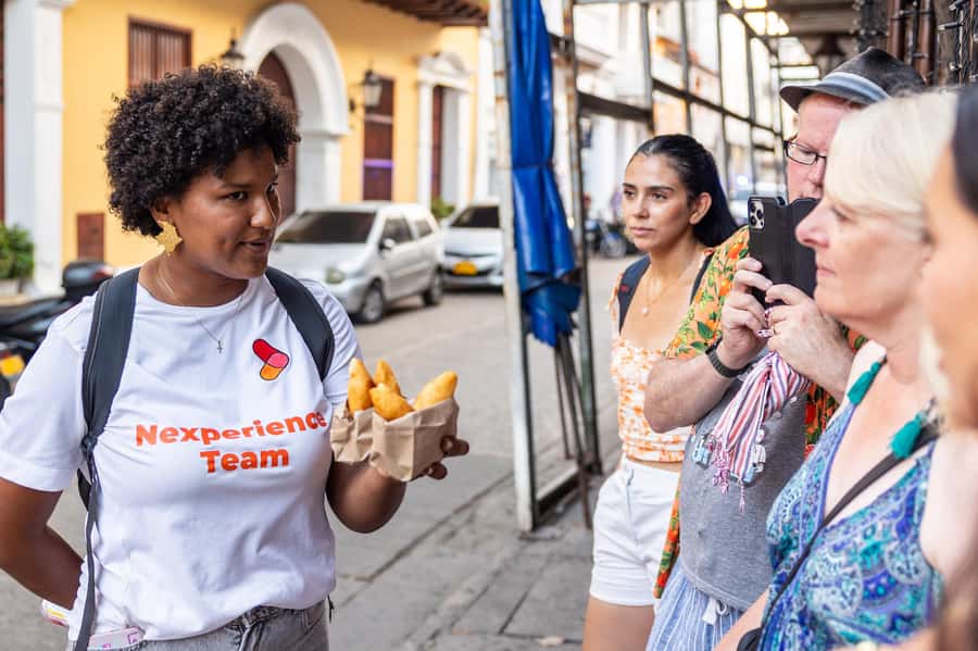 Cartagena: Guided Street Food Tour with Tastings - Starting beneath the orange umbrellas at Plaza Cervantes