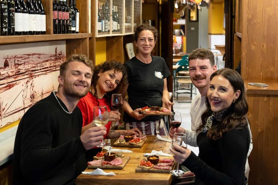 Florence: Food Walking Tour with Local Steak and Tuscan Wine - The old wine window and Tuscan aperitivo
