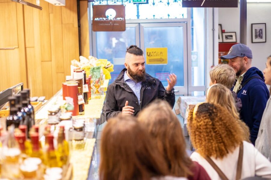 Florence: Grocery Market Food Tour and Tastings with a chef - Tuscan cheese at the market counter