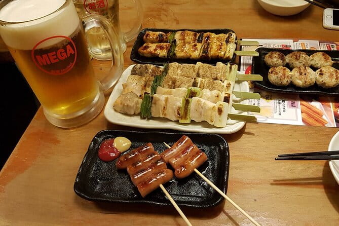 Fukuoka Evening Tours: Yatai, Izakaya, Karaoke and more - Nakasu yatai stalls and the first taste of Fukuoka