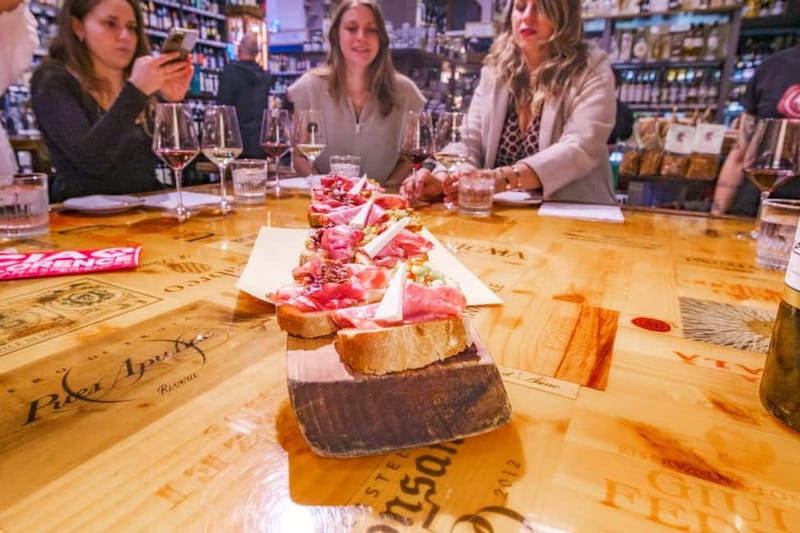 Guided Wine and Food Walk in Florence with Three Tastings - First stop: a Florence enoteca with regional variety
