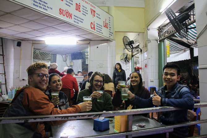 Half-Day Hanoi Food Walking Tour - Walking from the market into Hanoi’s Old Quarter