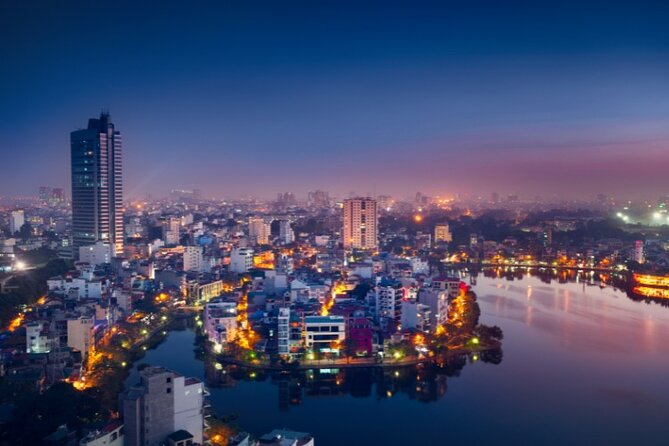 Hanoi City Motorbike Tour with Banana Island and Local Food - Crossing Long Bien Bridge and finding Train Street