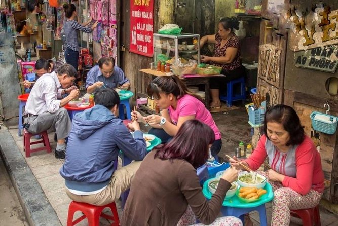 Hanoi Michelin Star Walking Food Tour & Train Street - Making spring rolls instead of just eating them