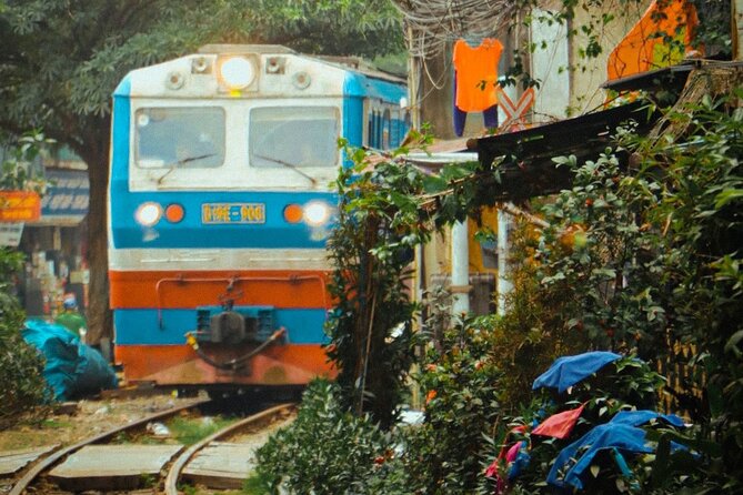 Hanoi Walking Street Food Tour with Train-Street Visit - A food-first way to see Hanoi