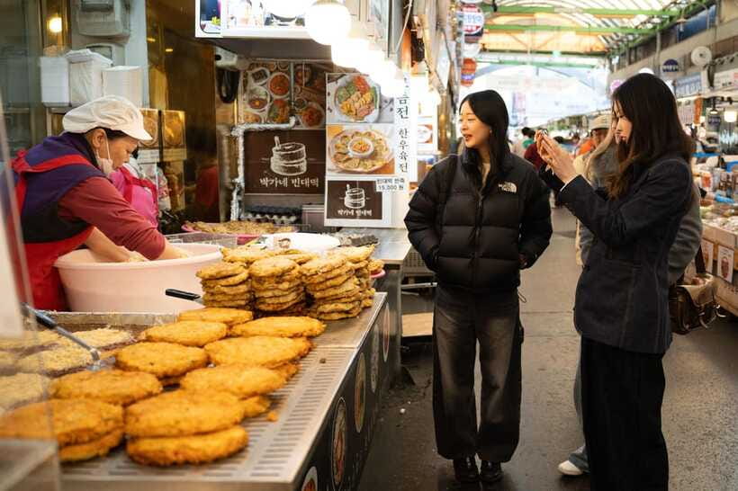 Hidden Stories & Flavors: Traditional Market Food Tour - Sweet pancakes and fish-shaped buns to finish