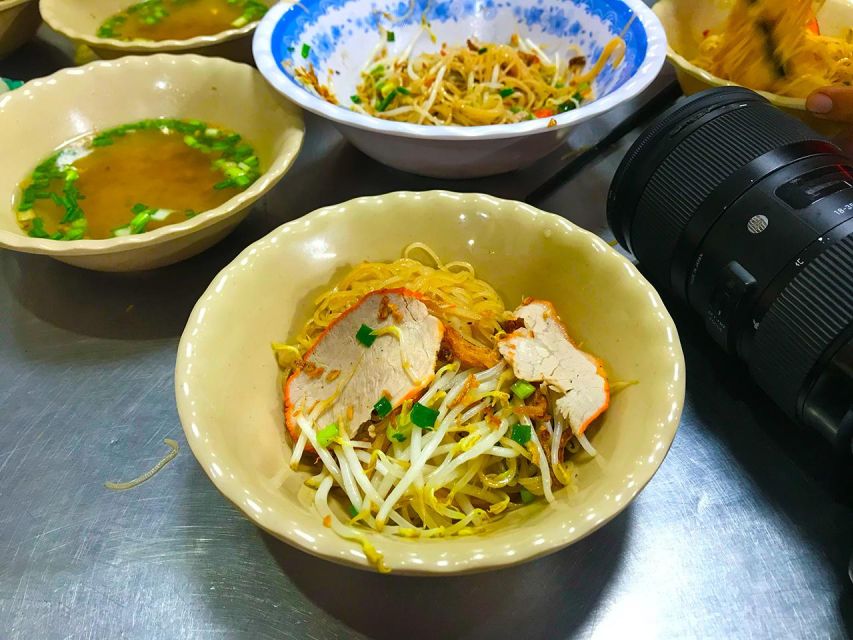 Ho Chi Minh City: Street Foodie Night Cycling Tour - Crossing into District 10 for the longest food section