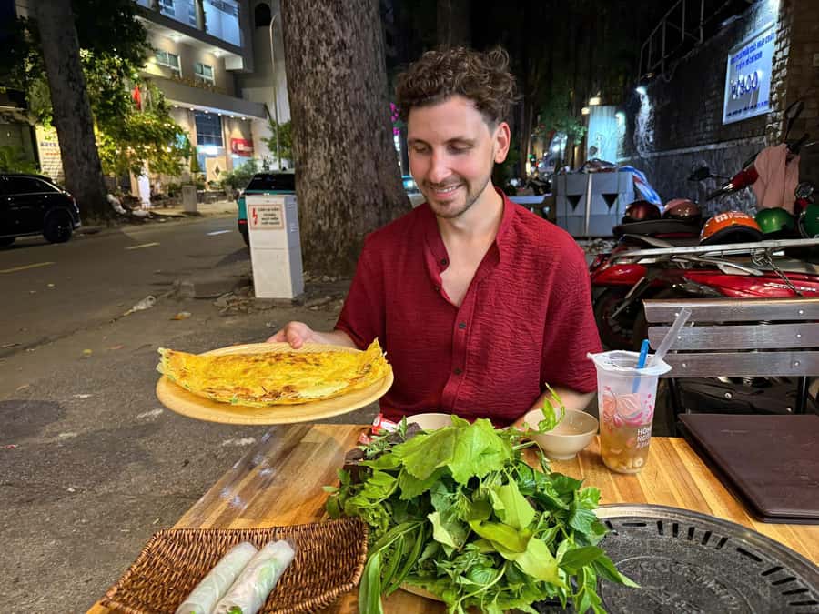 Ho Chi Minh: Local Food Tour by Scooter with Vegan Option - Vietnamese pizza and the fun of eating with your hands