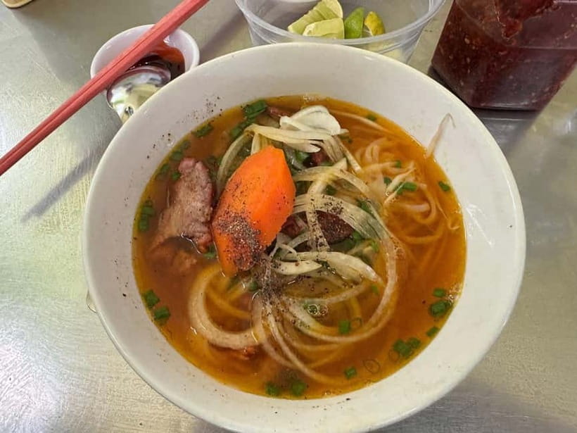 Ho Chi Minh: Original Walking Street Food Tour with Foodies - Hotel pickup, Grab rides, and the first food stop