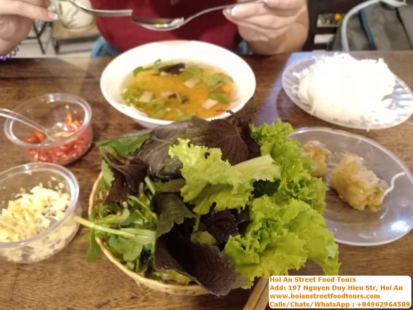 Hoi an food tour with 8 different street food tasting - Quang Noodles with shrimp, pork, herbs, and peanuts
