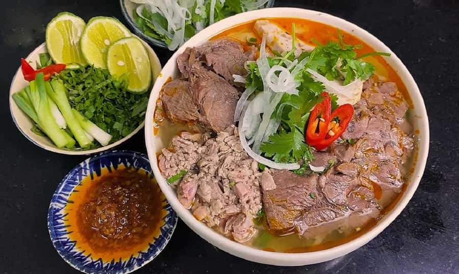 Hue Street Food Walking Tour with Local Dishes - Bún hến, a bowl with plenty going on