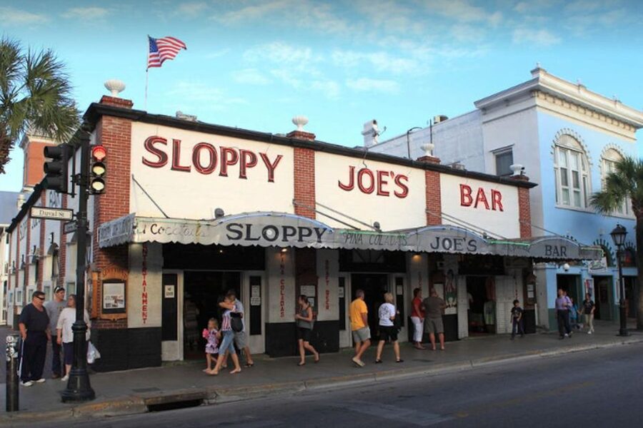 Key West: Hemingway's Life and Local Food Walking Tour - The bookstore, train stop, and everyday Key West