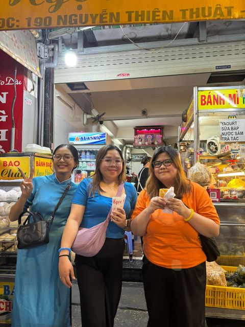KISSTOUR| Saigon By Night & Street Food Tour on Motorbike - Riding with an ao dai-clad English-speaking guide