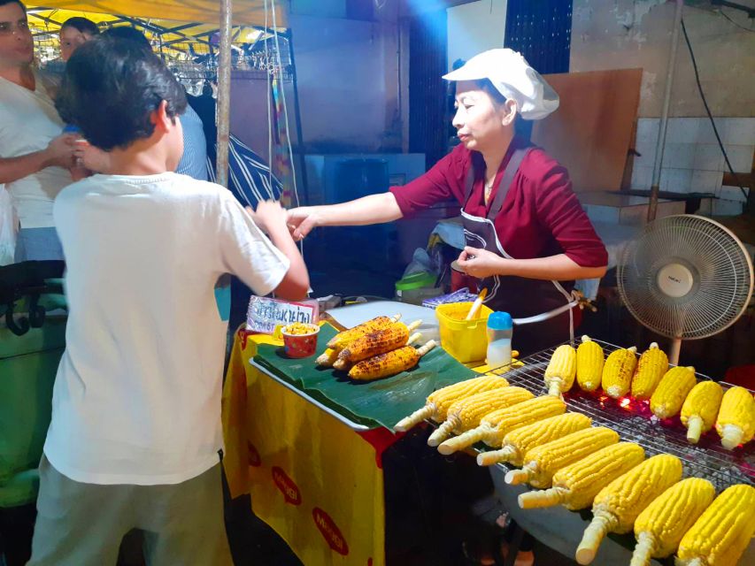 Krabi: Local Street Food Night Tour - Choosing grilled seafood at the market