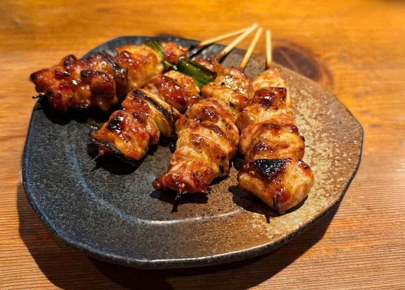 Kyoto: Guided Local Food Tour with 13 dishes - First stop: charcoal-grilled yakitori in a lantern-lit izakaya
