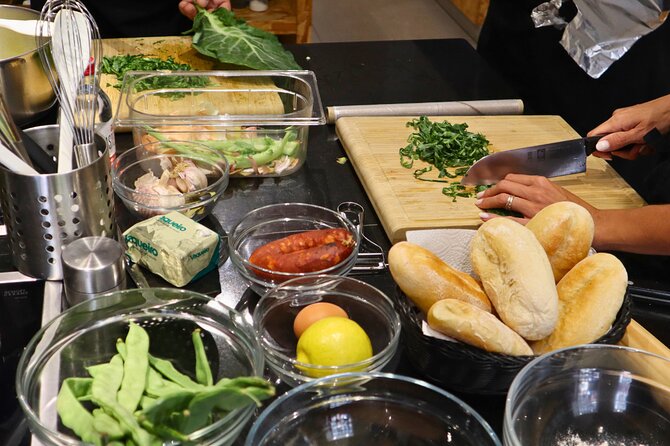 Lisbon: Portuguese street food cooking class with Drinks - Rolling up your sleeves at the cooking stations