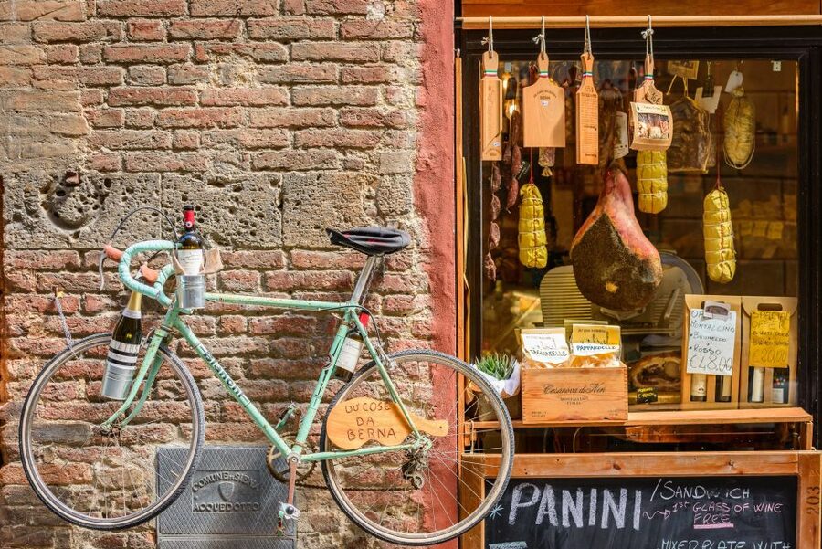 Lucca: Guided Food Walking Tour with Tastings - The first stop, wine, cheese, and Luccan conversation