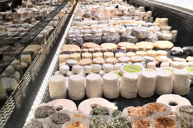 Lyon Morning Food Market Tasting Tour in Les Halles Paul Bocuse - A morning among fish, oysters, cheese, and wine