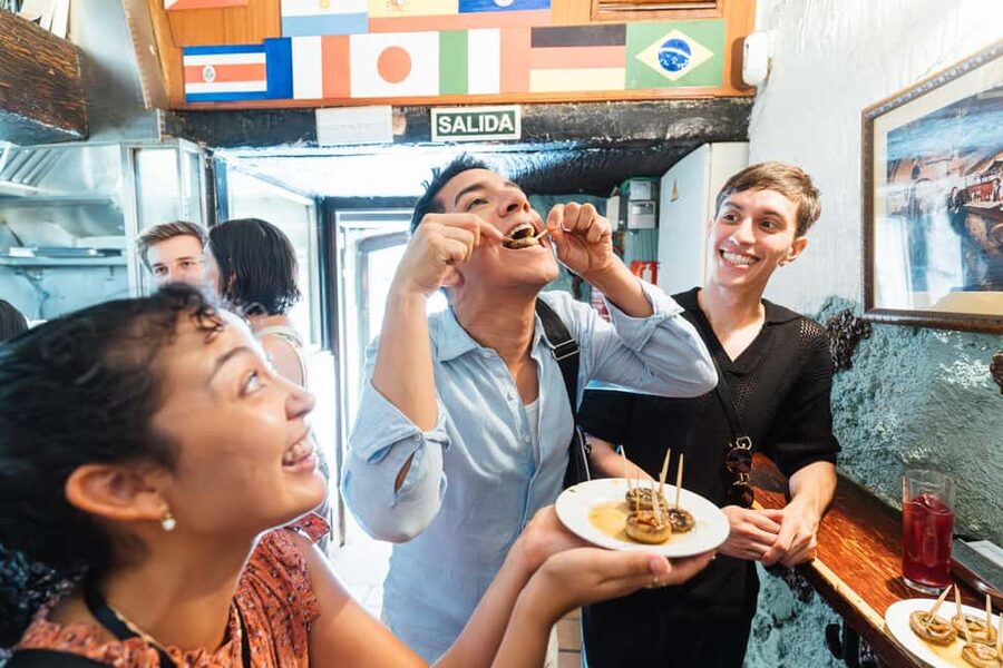Madrid: Food Walking Tour with Drink and Local Guide - Walking through La Latina