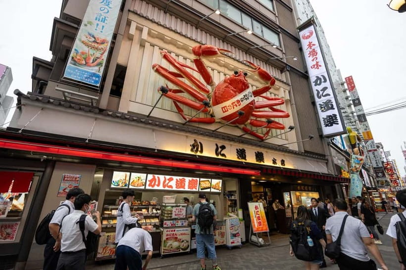 Osaka: Food Tour Kuromon Market & Dotonbori with Guide - Hozenji, okonomiyaki, and kushikatsu