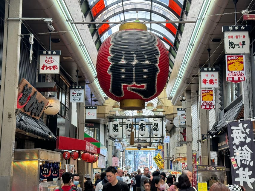 Osaka: Kuromon Market 1.5-Hour Seafood & Street Food Tour - Walking through Kuromon Market