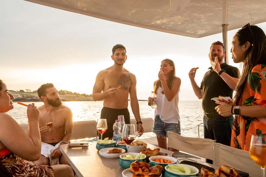 Polignano a Mare: Catamaran Tour with Aperitif & Local Food - Grotta Palazzese, the Hermit’s Rock, and Cala Port’Alga
