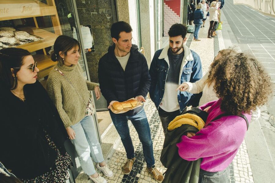 Porto: Evening Local Food Crawl with Drink Pairings - Stop three: sausages, codfish, and family cooking