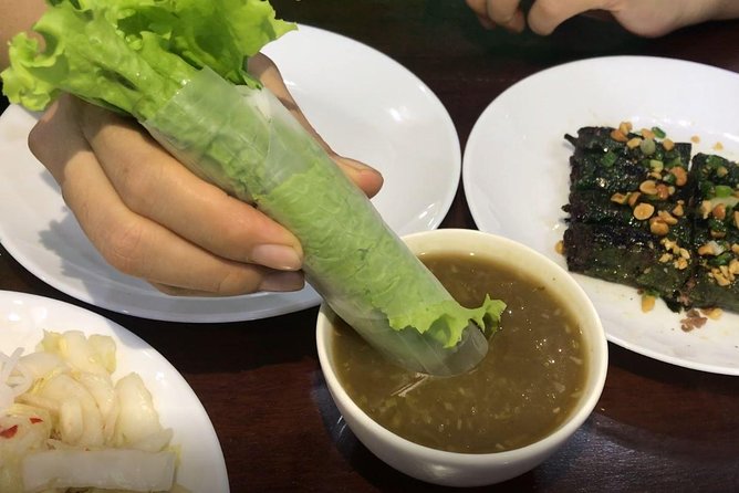 Private Ho Chi Minh Street Food Tour by Motorbike with Ao Dai Female Rider - Second tasting: a bowl of beef or crab noodles