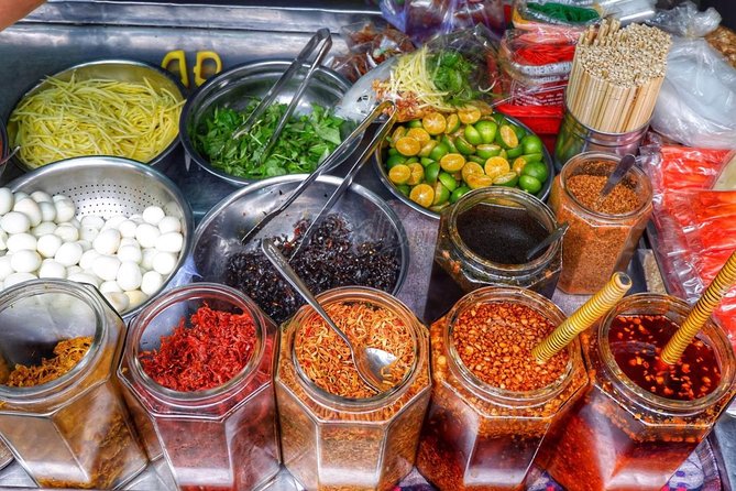 Private Saigon Street Food Tour with Motorbike - Stop three: noodle soups from north, central, and south Vietnam