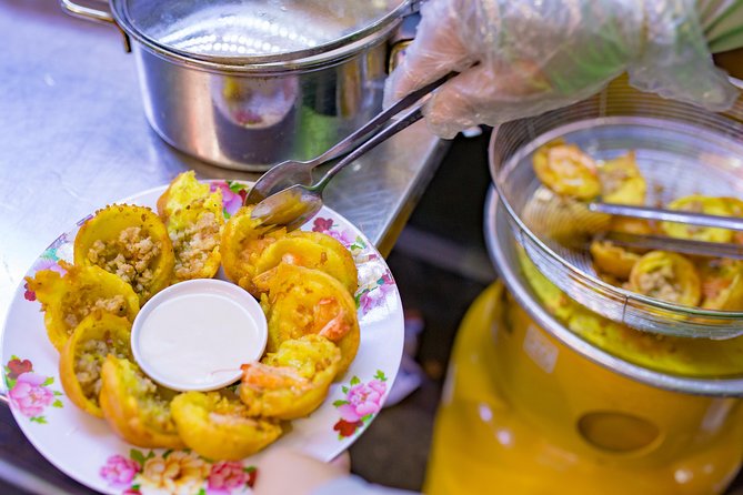 Private Street Food Evening Walking Tour in Ho Chi Minh City - Leaving the tourist center by taxi
