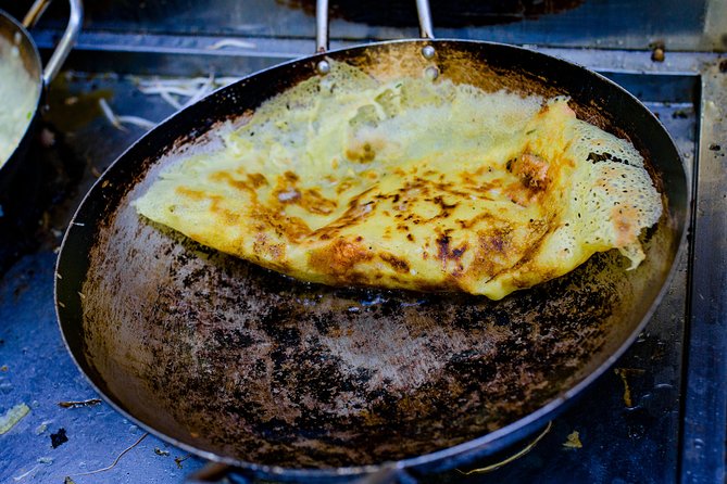 Private Street Food Evening Walking Tour in Ho Chi Minh City - Street barbecue, bo la lot, and local noodle soup