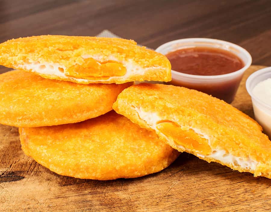 Private Street Food Tour in Walled City and Getsemani - Trying arepa de huevo and carimañola