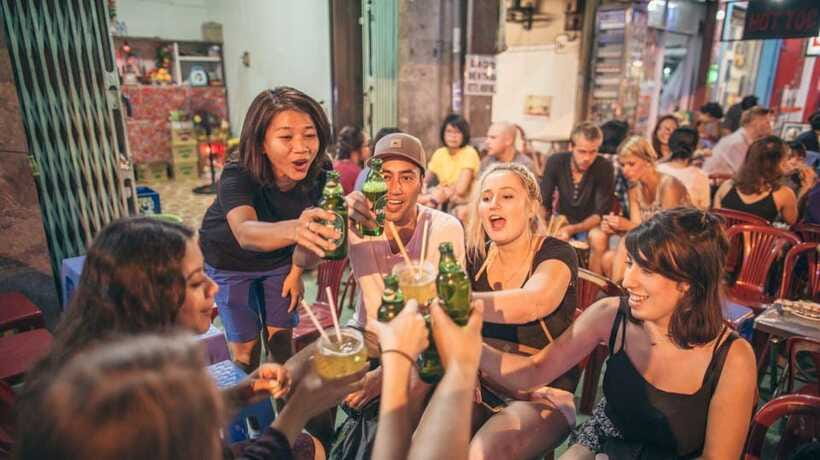 Saigon at Sunset: Ultimate Street Food Experience - Beer, peanuts, and the city after dark
