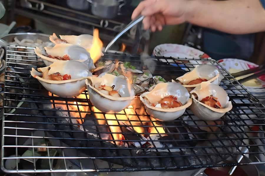 Saigon: Best Price Authentic Walking Street Food Tour - Beef in betel leaf and fresh spring rolls