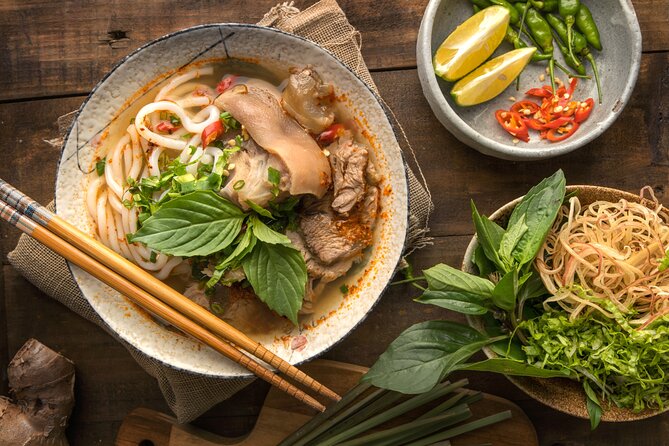 Saigon By Night and Vietnam Local Food on Motorbike - Bun bo Hue brings central Vietnam to the table