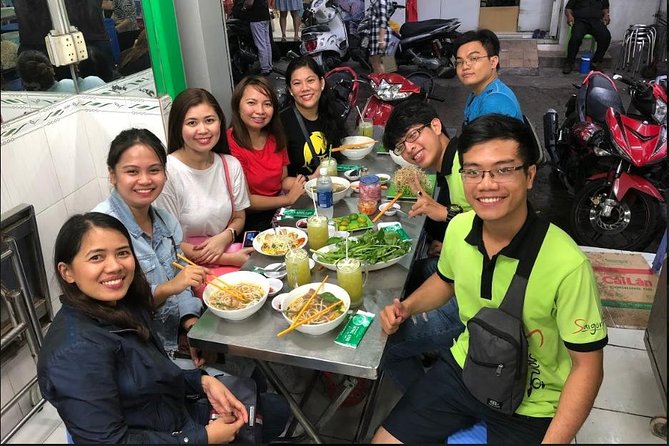 Saigon Night Sights & Local Food by Motorbike| Opt: Ao Dai Riders - A 1986 building and the city’s layered past