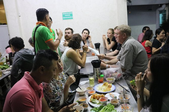 Saigon Vespa By Night Street Food Tour 4,5 Hours - Local restaurants, seafood, and a full evening meal