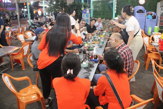 Saigon Vespa By Night Street Food With Female Riders Ao Dai - Mango dessert at a tucked-away shop