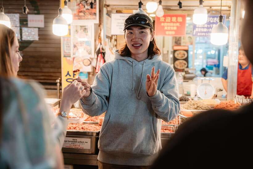 Seoul: Night Market Food Tour with Local Guide - Entering Gwangjang Market after dark